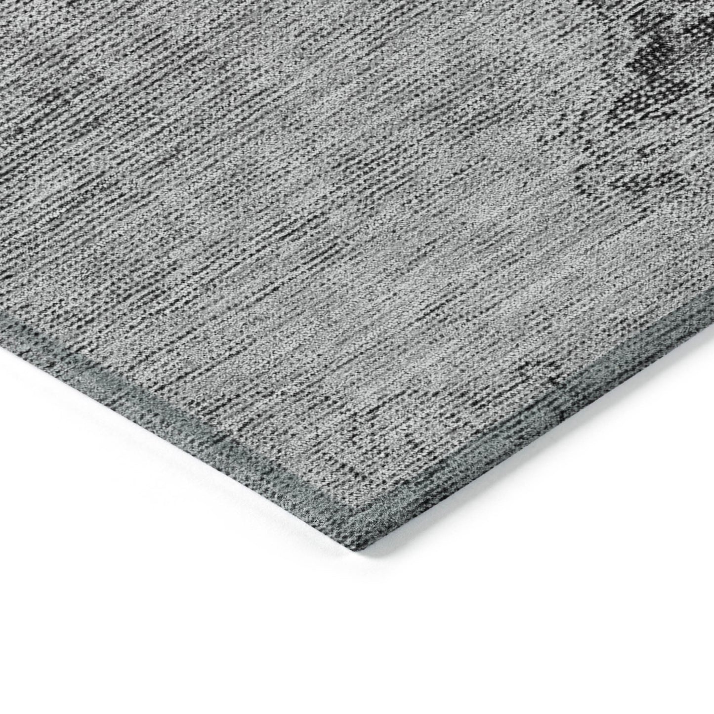 Gray textured rug corner on a white background
