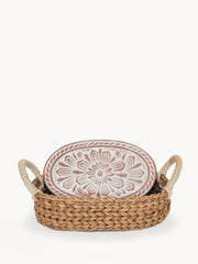 Bread warmer with flower design in a handwoven seagrass basket, natural colors.