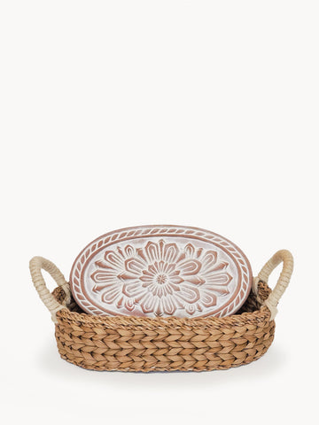 Bread warmer with flower design in a handwoven seagrass basket, natural colors.