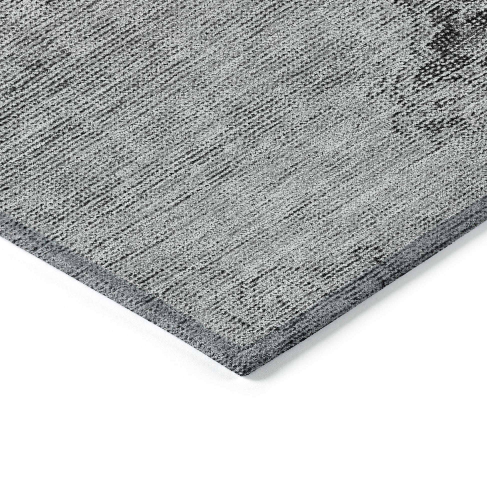 Gray textured rug corner on a white background